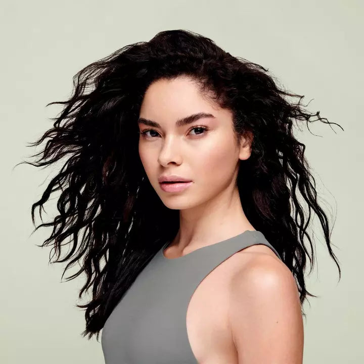 Model before and after use of Deva Curl Super Cream - Rich Coconut Infused Definer
