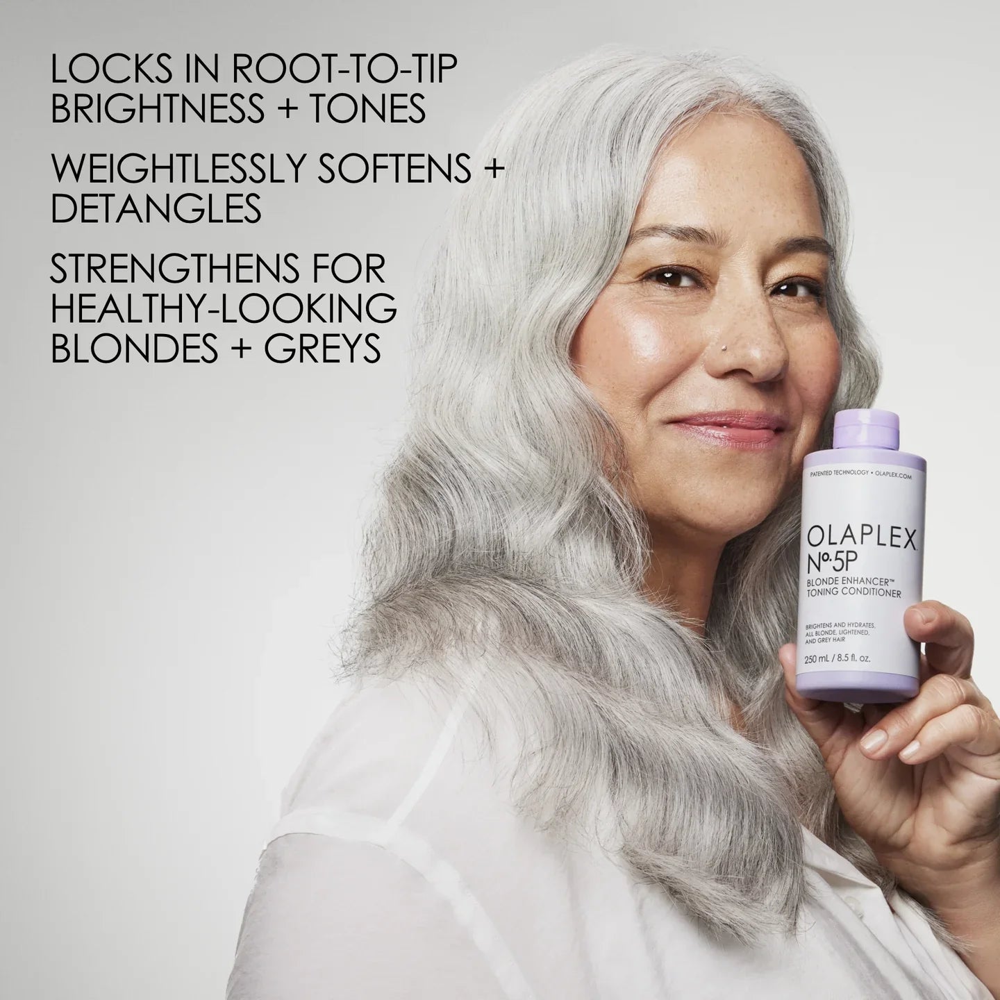 Olaplex No. 5P Blonde Enhancer Toning Conditioner locks in root-to-tip brightness and tones, weightlessly softens and detangles, and strengthens for healthy-looking blondes and greys