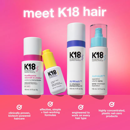 K18 hair care products on a pink gradient background