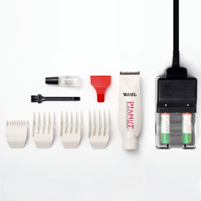 Wahl Professional Peanut Cordless Clipper/Trimmer. Includes 4 attachment combs (1/8" - 1/2"), 2 rechargeable batteries, recharging battery stand, oil, cleaning brush, instructions & red blade guard